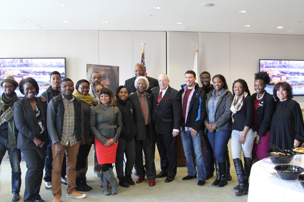 At UMass Boston Alumni Lounge, Marvin and Paul are in the center. Behind them stands Chancellor J. Keith Motley. Front row, second in from the left, Liliana Mickle, Special Assistant to the Vice Provost. At the far right, Assistant Vice Chancellor Gail Hobin; second in on far right, Coordinator of Community Services Alkia Powell. Other people pictured are some of the UMass Boston students who attended.