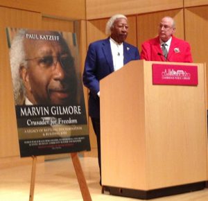 Marvin (left) and Paul share a podium at the Cambridge Public Library.