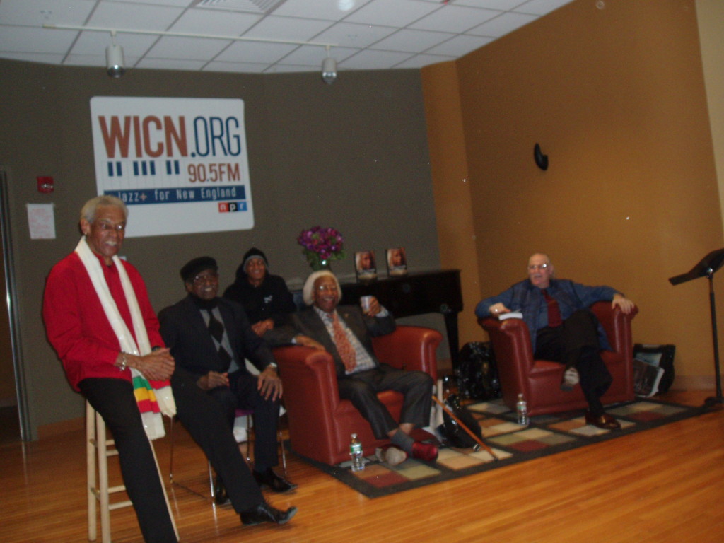 In the WICN-FM studio, seated in armchairs, Marvin (center) and Paul take a question from a member of the studio audience.